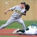 Michigan freshman Dylan Delaney looks to receive the ball as he is beat by Eastern Michigan senior Ben Magsig at Eastern on Wednesday.  Melanie Maxwell I AnnArbor.com